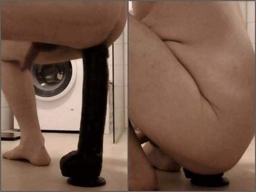 Anal – Male rides on the Epic black dildo fully in the bathroom